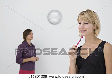 Stock Photo - A business woman thinking. Fotosearch