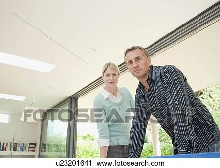 Stock Image - A contemporary business couple.. Fotosearch
