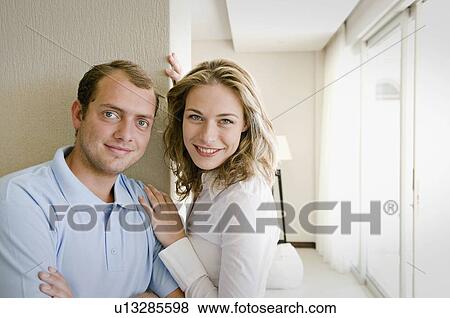 Stock Photo - A couple in their home. Fotosearch