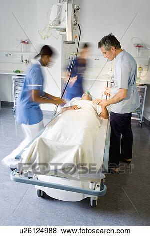 A doctor helping a patient in hospital View Large Photo Image Stock Photo - A doctor helping a patient in hospital. Fotosearch