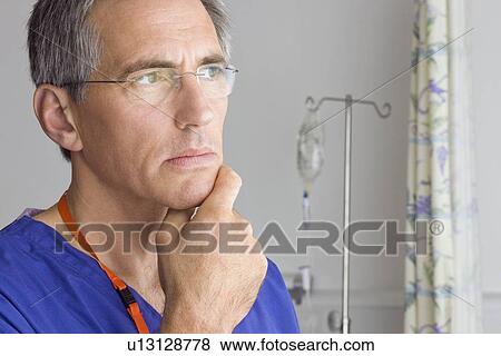 A doctor looking thoughtful View Large Photo Image Stock Photo - A doctor looking thoughtful. Fotosearch