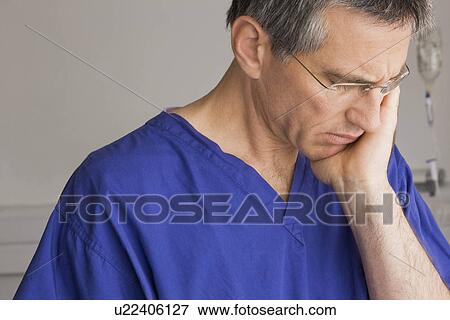A doctor looking worried View Large Photo Image Stock Photo - A doctor looking worried. Fotosearch