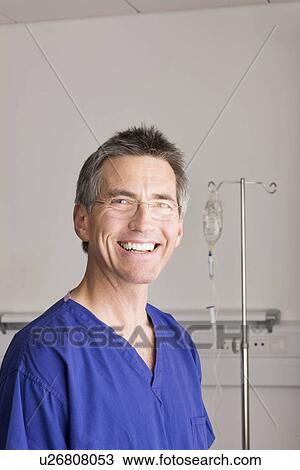 Stock Image - A doctor smiling to camera. Fotosearch
