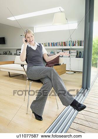 Stock Photo - A female business woman on the phone.. Fotosearch