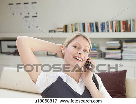 Stock Photo - A female business woman on the phone.. Fotosearch