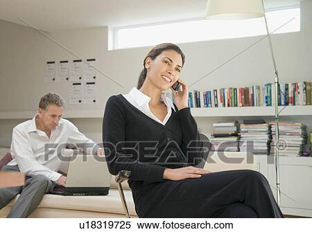 Stock Photography - A female business woman on the phone.. Fotosearch