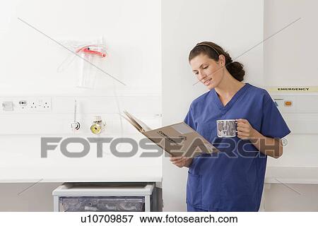 A female doctor on her break View Large Photo Image Stock Photo - A female doctor on her break. Fotosearch