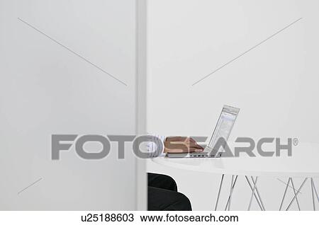A man on his laptop View Large Photo Image Stock Image - A man on his laptop. Fotosearch