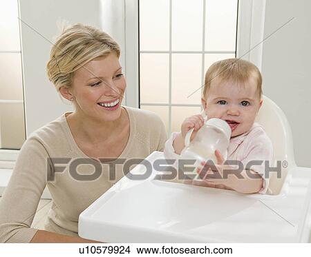 Picture - A mother and her baby girl. Fotosearch