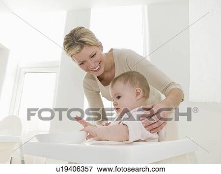 Stock Photo - A mother and her baby girl. Fotosearch