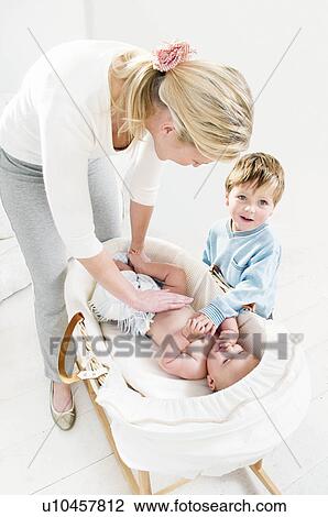 Stock Image - A mother and her children.. Fotosearch
