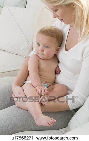 Stock Image - A mother holding her child. Fotosearch