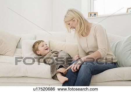 Stock Photograph - A mother playing with her son.. Fotosearch