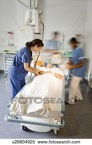 Stock Photography - A patient in a hospital bed. Fotosearch