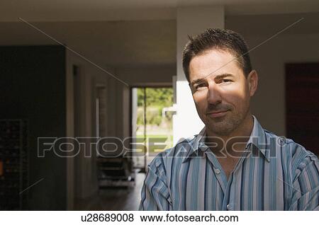 A portrait of a man in shaded light View Large Photo Image Stock Photo - A portrait of a man in shaded light. Fotosearch