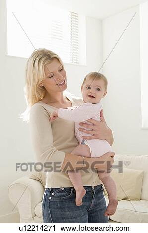 Stock Image - A portrait of a mother and baby. Fotosearch