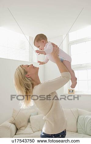 A portrait of a mother and baby View Large Photo Image Stock Image - A portrait of a mother and baby. Fotosearch