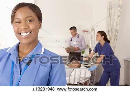Stock Photo - A portrait of a nurse smiling. Fotosearch