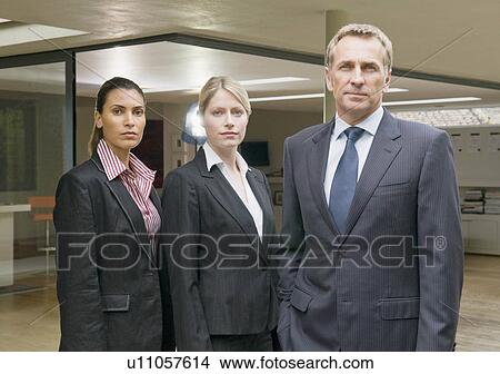 A portrait of three business people. View Large Photo Image Picture - A portrait of three business people.. Fotosearch