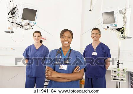 Picture - A portrait of three doctors smiling. Fotosearch