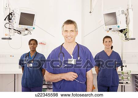 Stock Photo - A portrait of three doctors smiling. Fotosearch