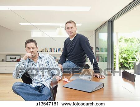 Stock Image - A portrait of two businessmen. Fotosearch