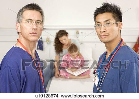 Picture - A portrait of two doctors and a patient. Fotosearch