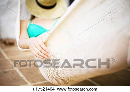 A woman in a hammock View Large Photo Image Picture - A woman in a hammock. Fotosearch
