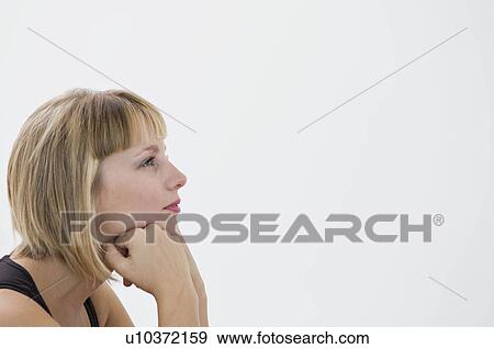 Stock Photo - A woman thinking.. Fotosearch