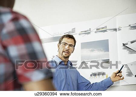 Picture - Architects working on a project. Fotosearch