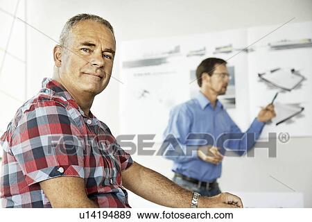 Stock Photo - Architects working on a project. Fotosearch