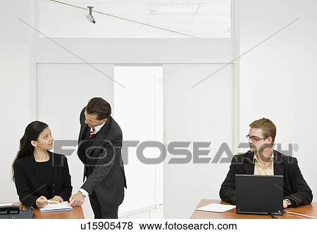 Boss helping co-workers View Large Photo Image Stock Photo - Boss helping co-workers. Fotosearch