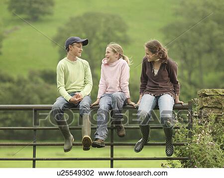 Boy And Girls Sitting On Gate View Large Photo Image Stock Image - Boy And Girls Sitting On Gate. Fotosearch