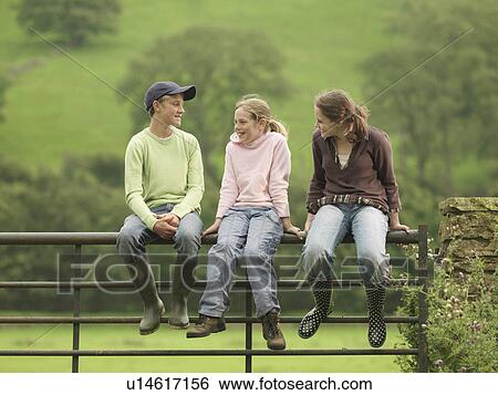 Boy And Girls Sitting On Gate View Large Photo Image Stock Photograph - Boy And Girls Sitting On Gate. Fotosearch