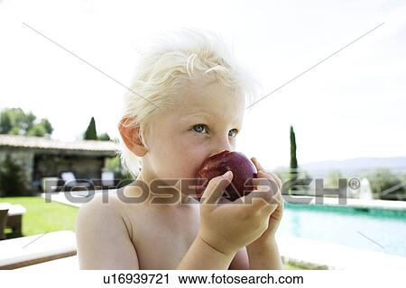 Stock Image - Boy Eating an Apple. Fotosearch