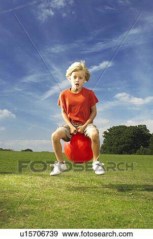 boy on space hopper View Large Photo Image Stock Photo - boy on space hopper. Fotosearch