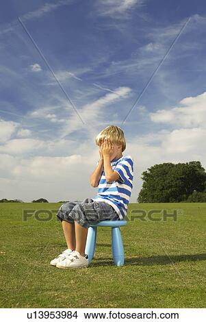 boy sitting on stool View Large Photo Image Picture - boy sitting on stool. Fotosearch