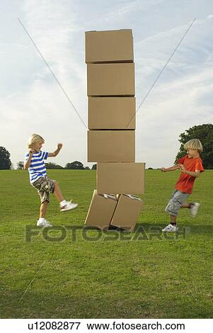 boys kicking boxes View Large Photo Image Stock Photo - boys kicking boxes. Fotosearch