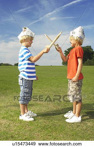 Stock Photo - boys with crossed swords. Fotosearch