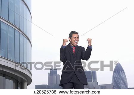 Stock Photo - Business man celebrating. Fotosearch