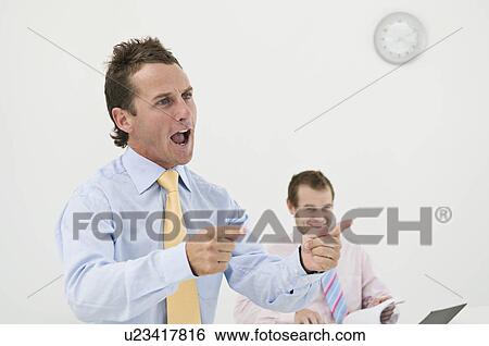 Stock Photograph - Business man giving a talk. Fotosearch