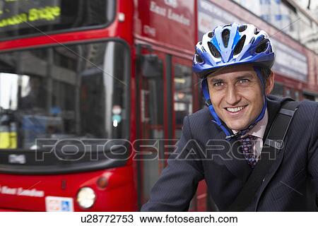 Business man on a bicycle View Large Photo Image Stock Image - Business man on a bicycle. Fotosearch