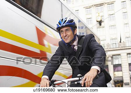 Stock Image - Business Man on Bicycle. Fotosearch