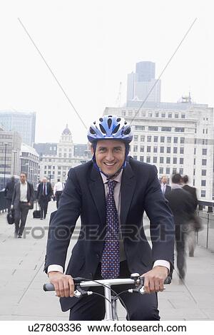 Business man on bicycle View Large Photo Image Stock Photograph - Business man on bicycle. Fotosearch