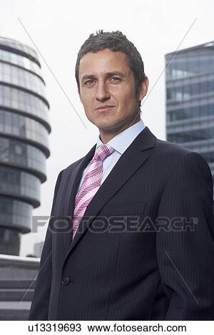 Stock Image - Business man outside. Fotosearch