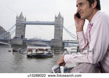 Business man using a mobile phone View Large Photo Image Stock Image - Business man using a mobile phone. Fotosearch
