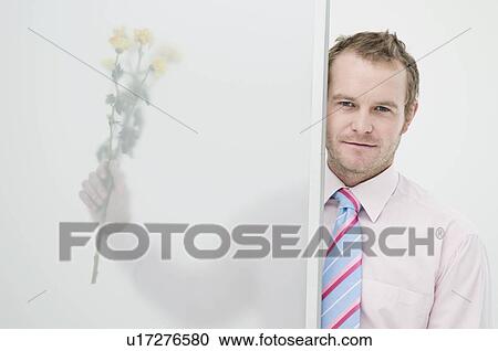 Business man with flowers View Large Photo Image Stock Image - Business man with flowers. Fotosearch