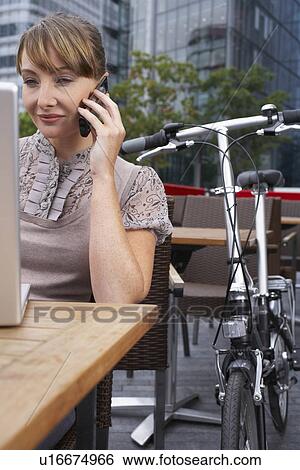 Business woman using mobile outside View Large Photo Image Stock Photograph - Business woman using mobile outside. Fotosearch