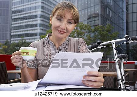 Stock Photo - Business woman working outside. Fotosearch