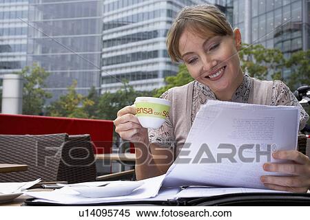 Stock Photography - Business woman working outside. Fotosearch